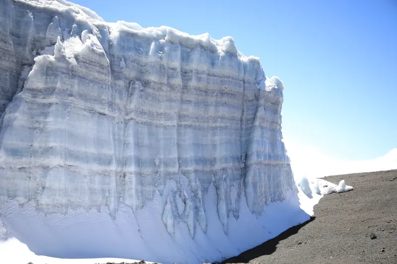 Towering blue-white glacier walls on Kilimanjaro