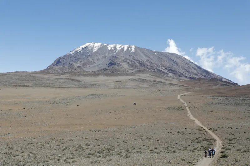 A winding trail across the plateau towards Kilimanjaro